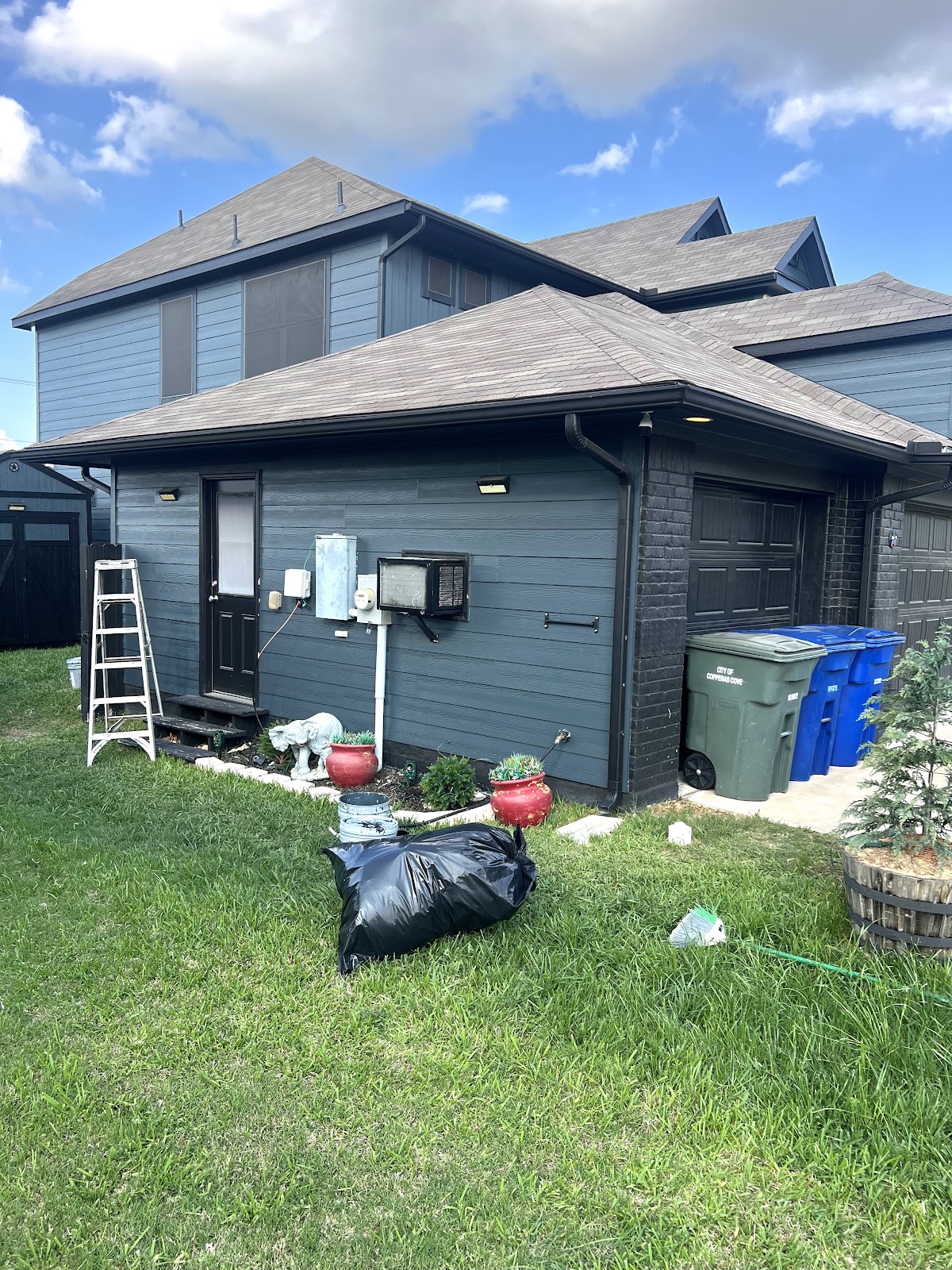Exterior painting: dark gray house siding completed