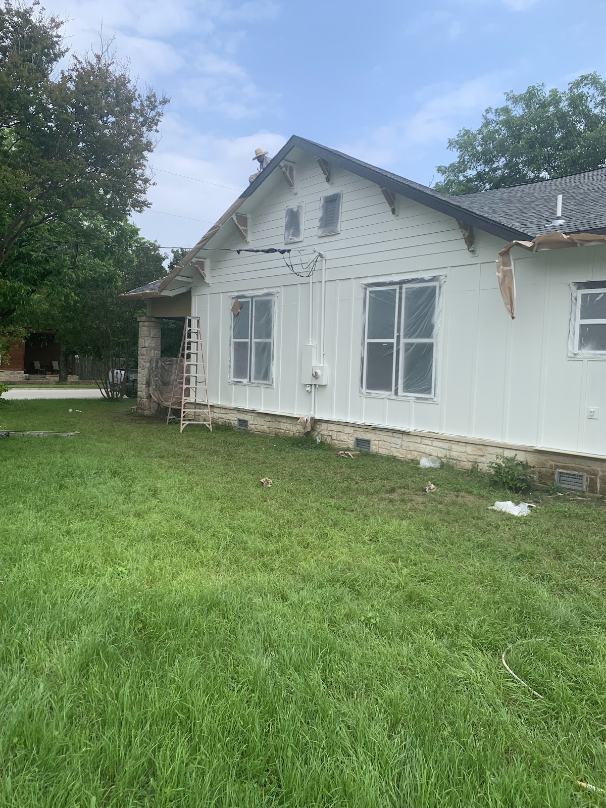 Accessible Painting crew at work on a house exterior in Lampasas TX