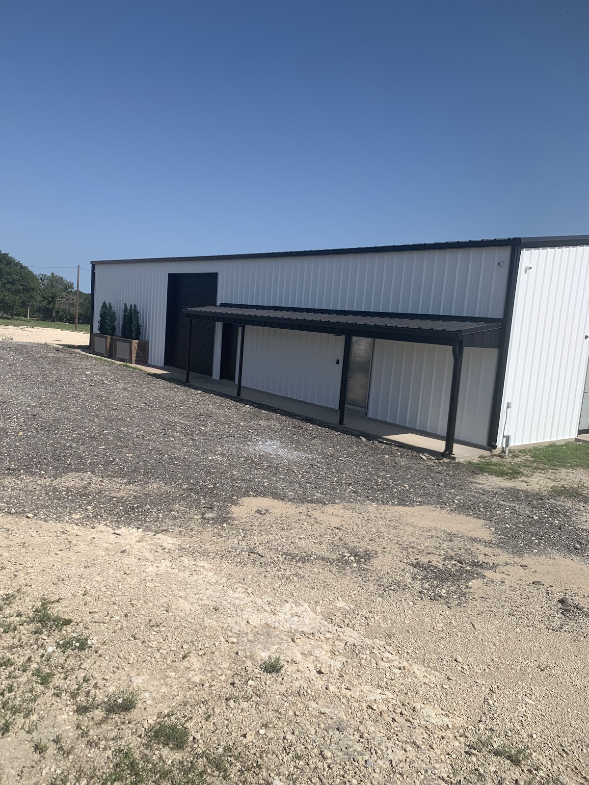 Commercial painting: metal building with black trim