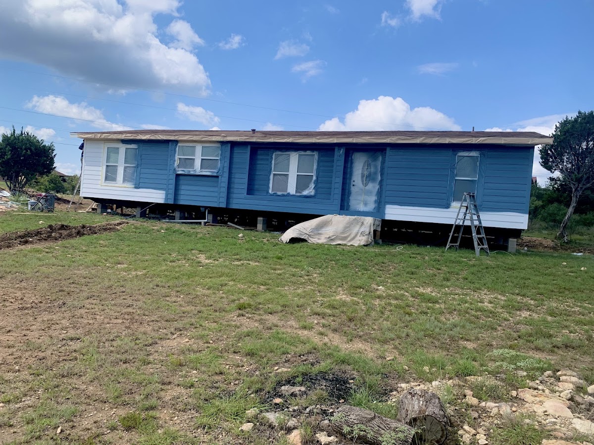 Exterior painting: manufactured home painted blue